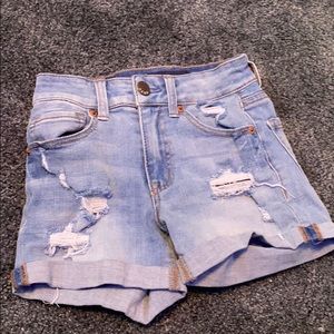 High waisted light blue ripped denim shorts